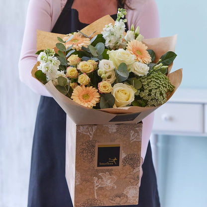Sympathy hand-tied made with the finest flowers