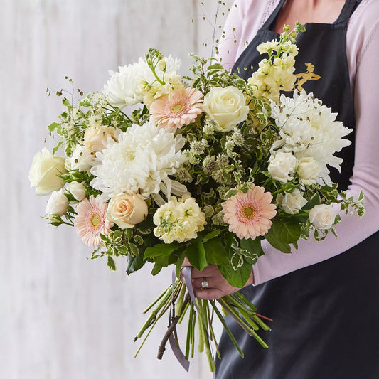 Sympathy hand-tied made with the finest flowers