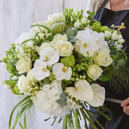Sympathy hand-tied made with the finest flowers